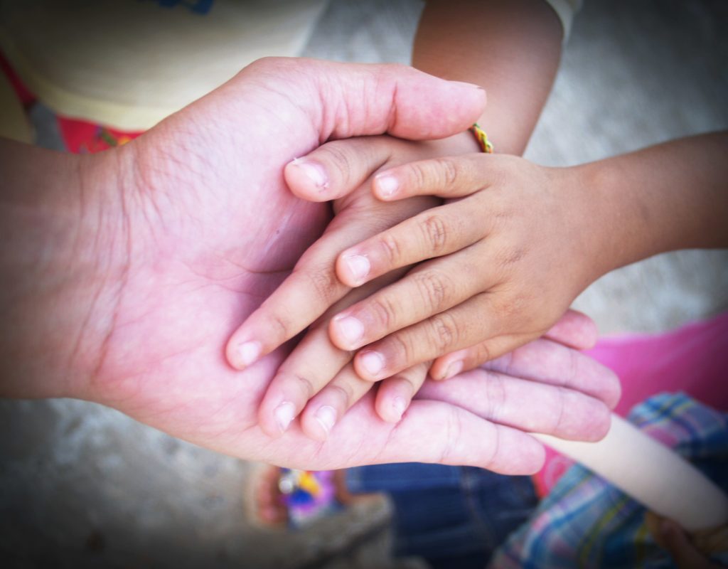 Photo: Hand of an elderly holding hand of youngerHand of an elderly holding hand of younger | Stay connected