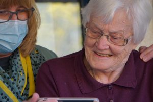 Elder lady with caregiver at home.