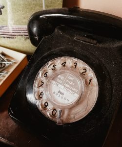 Evolution of Phones: black and silver rotary phone