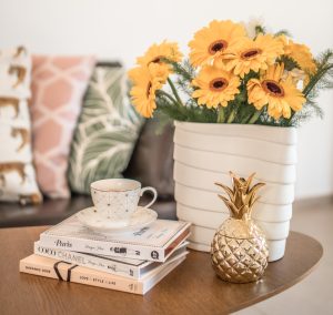 Before you sell your home - yellow flower on white ceramic vase
